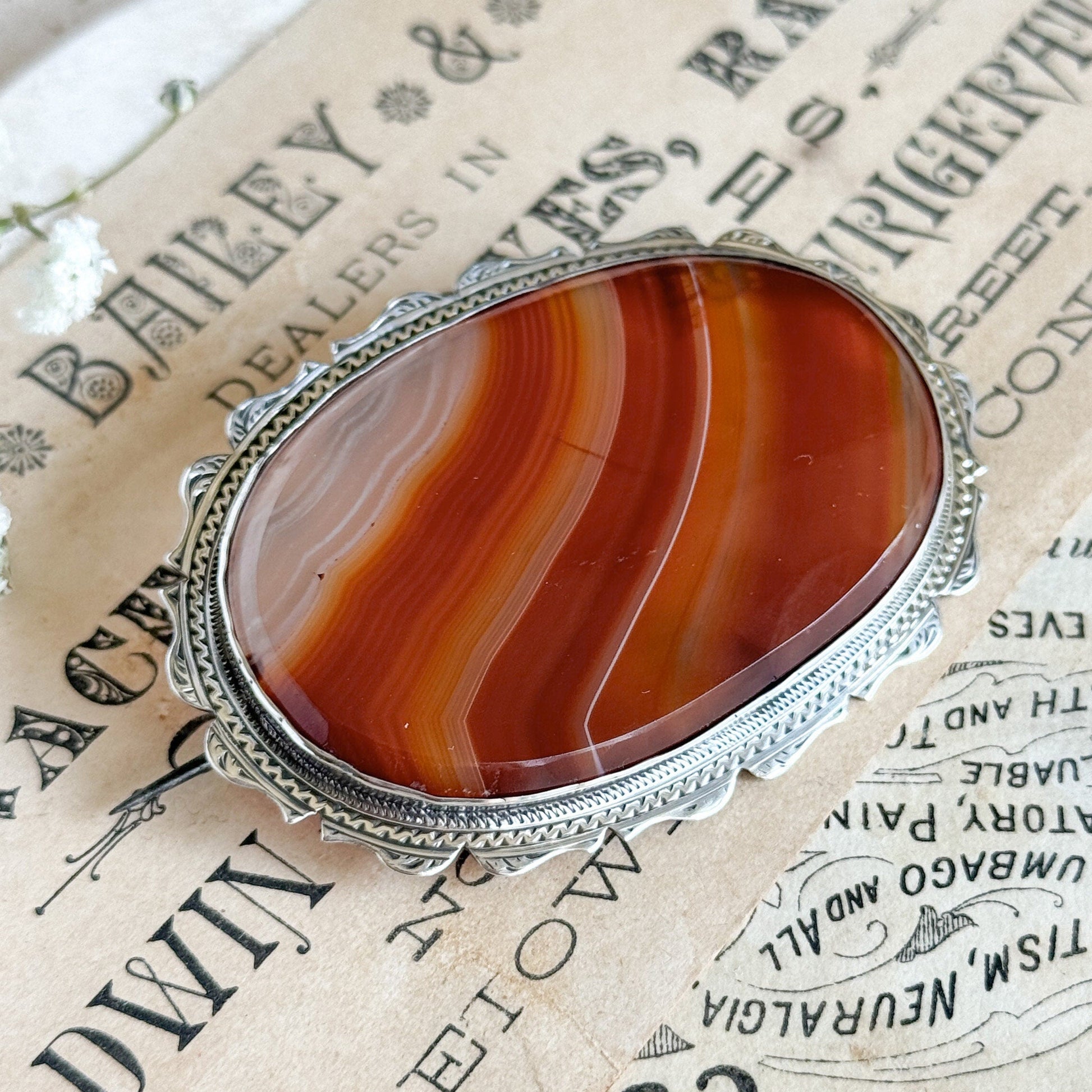 Victorian banded agate brooch in silver frame